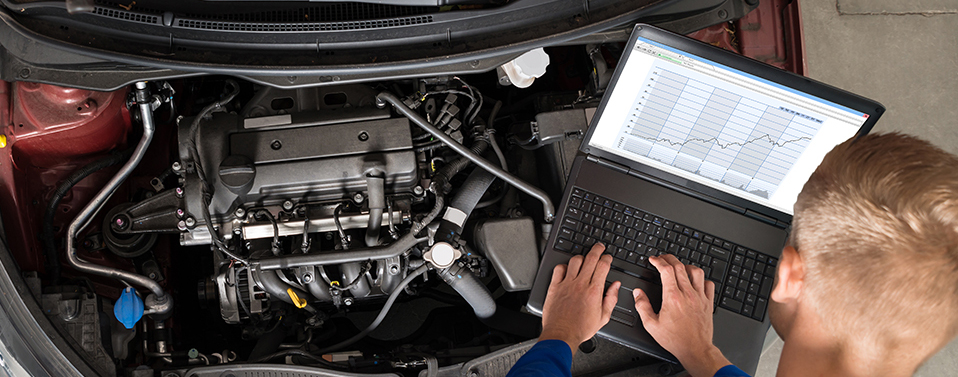 Mechanics diagnosing a vehicle - Car Diagnostics Welling